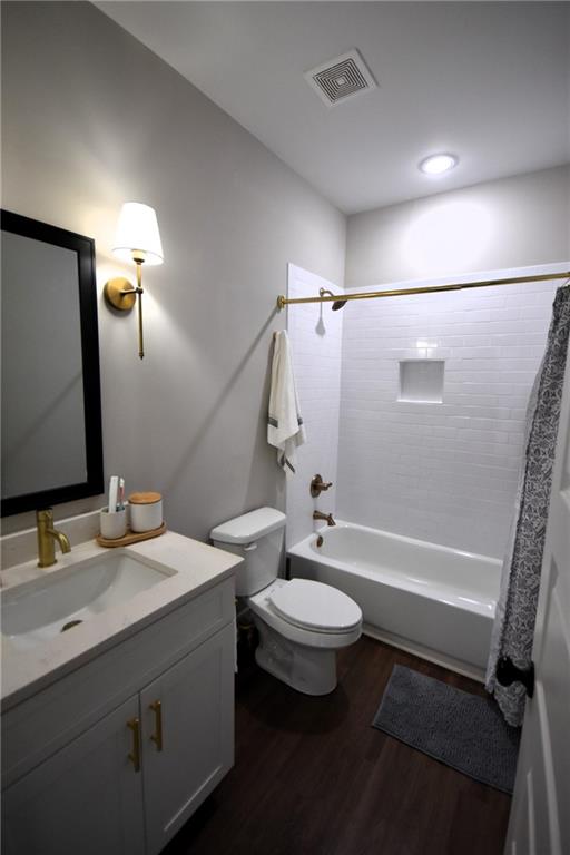 533 Lively Road Waco, GA 30182 - Photo 21 of 41 a bathroom with a double vanity sink toilet mirror and shower