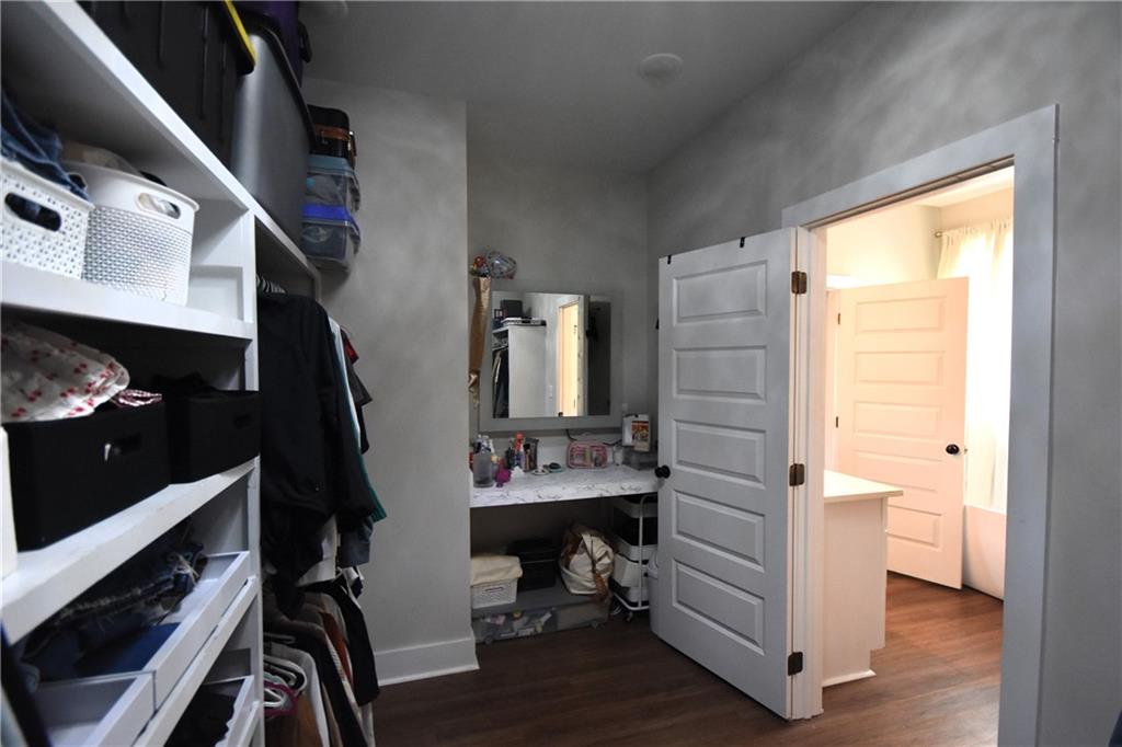 533 Lively Road Waco, GA 30182 - Photo 28 of 41 a view of walk in closet with clothes and shoes