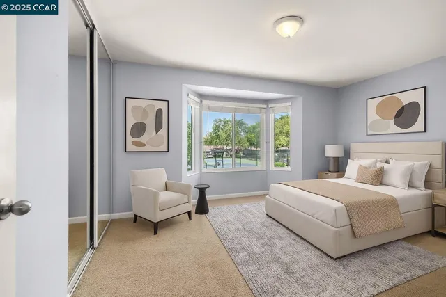 a bedroom with a bed and a couch