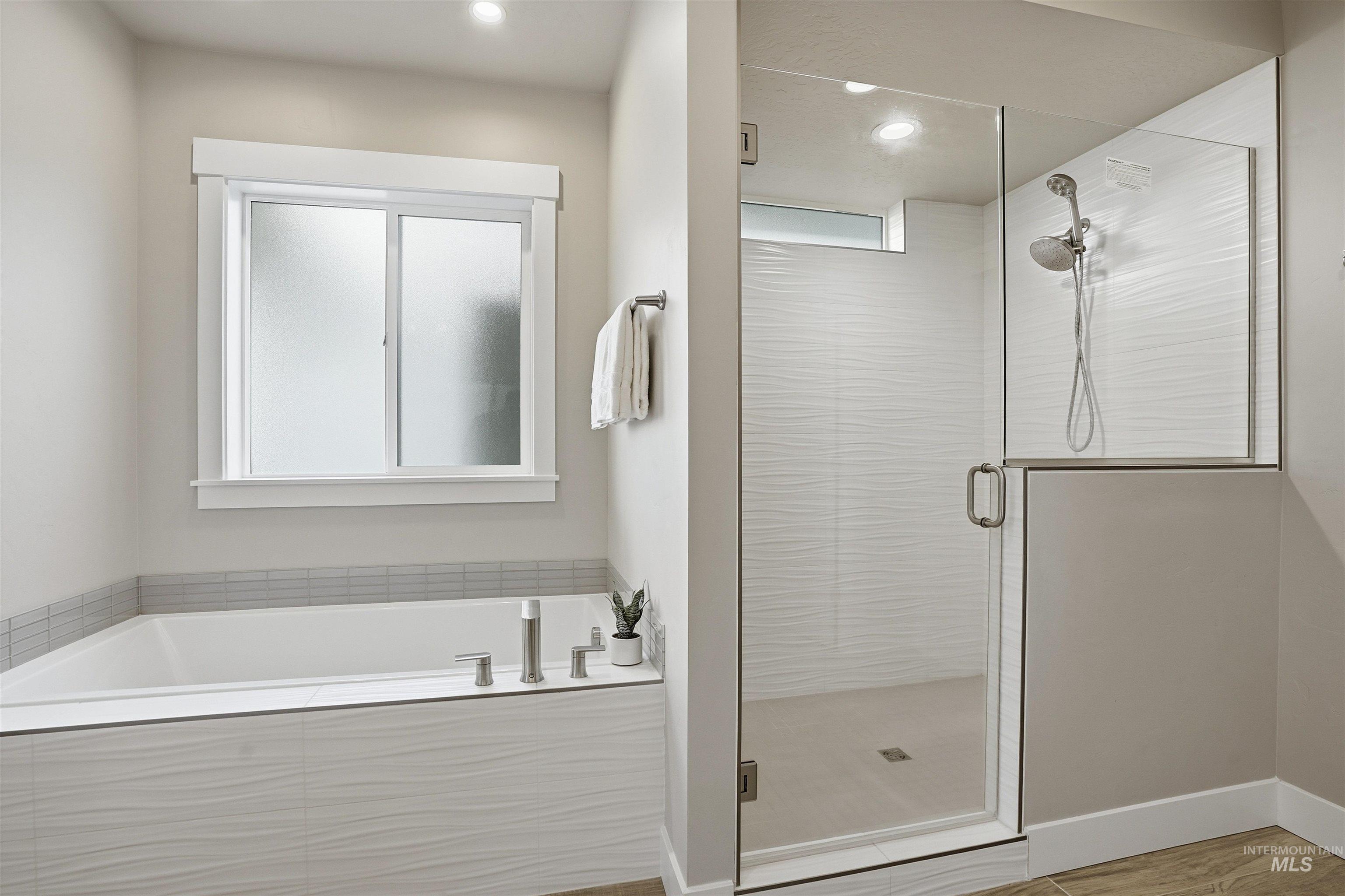 8087 Tandy Cove Street Middleton, ID 83644 - Photo 24 of 50 Full bathroom with a stall shower, a bath, and recessed lighting