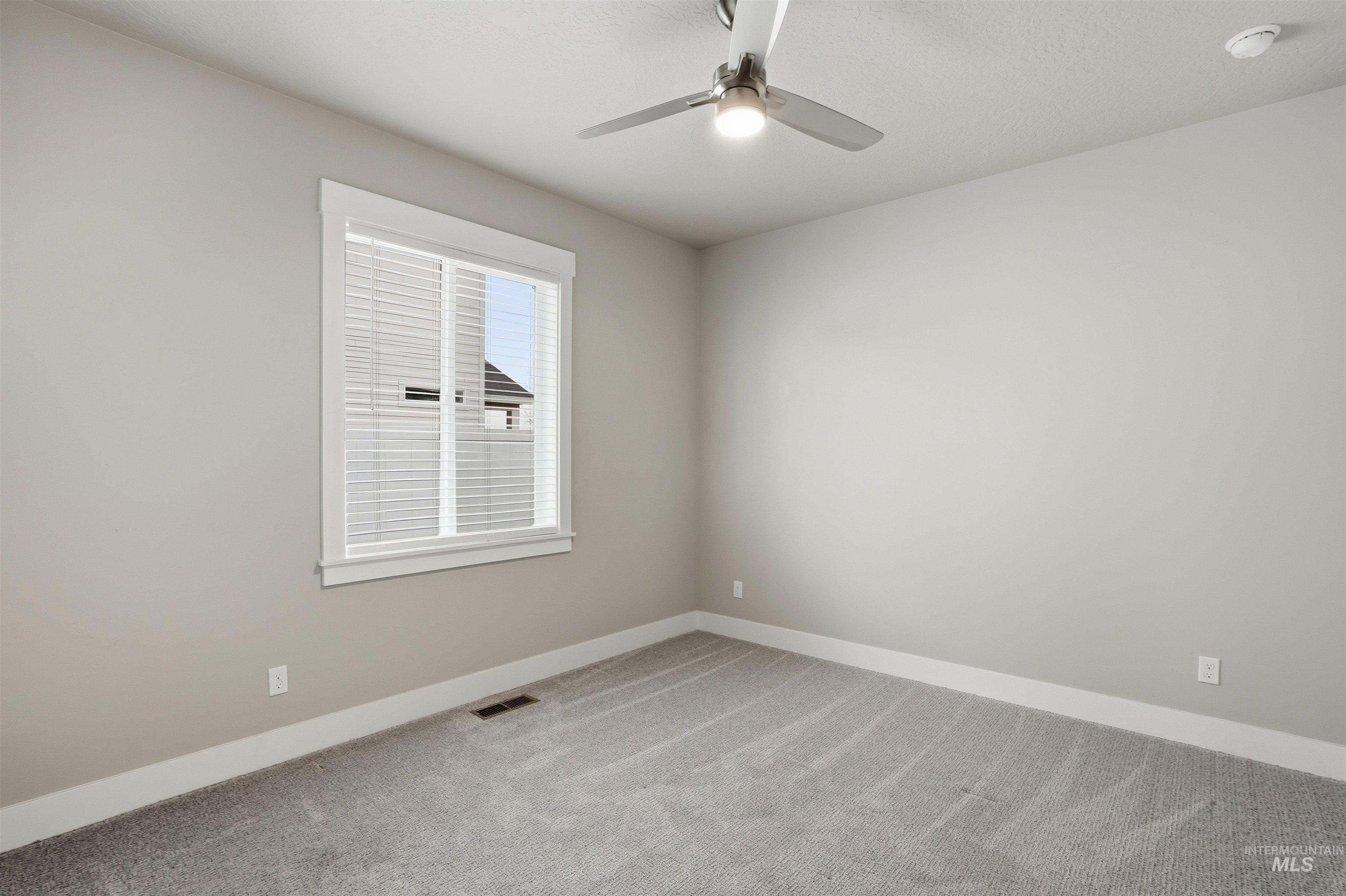 8087 Tandy Cove Street Middleton, ID 83644 - Photo 33 of 50 Unfurnished room with light colored carpet and baseboards
