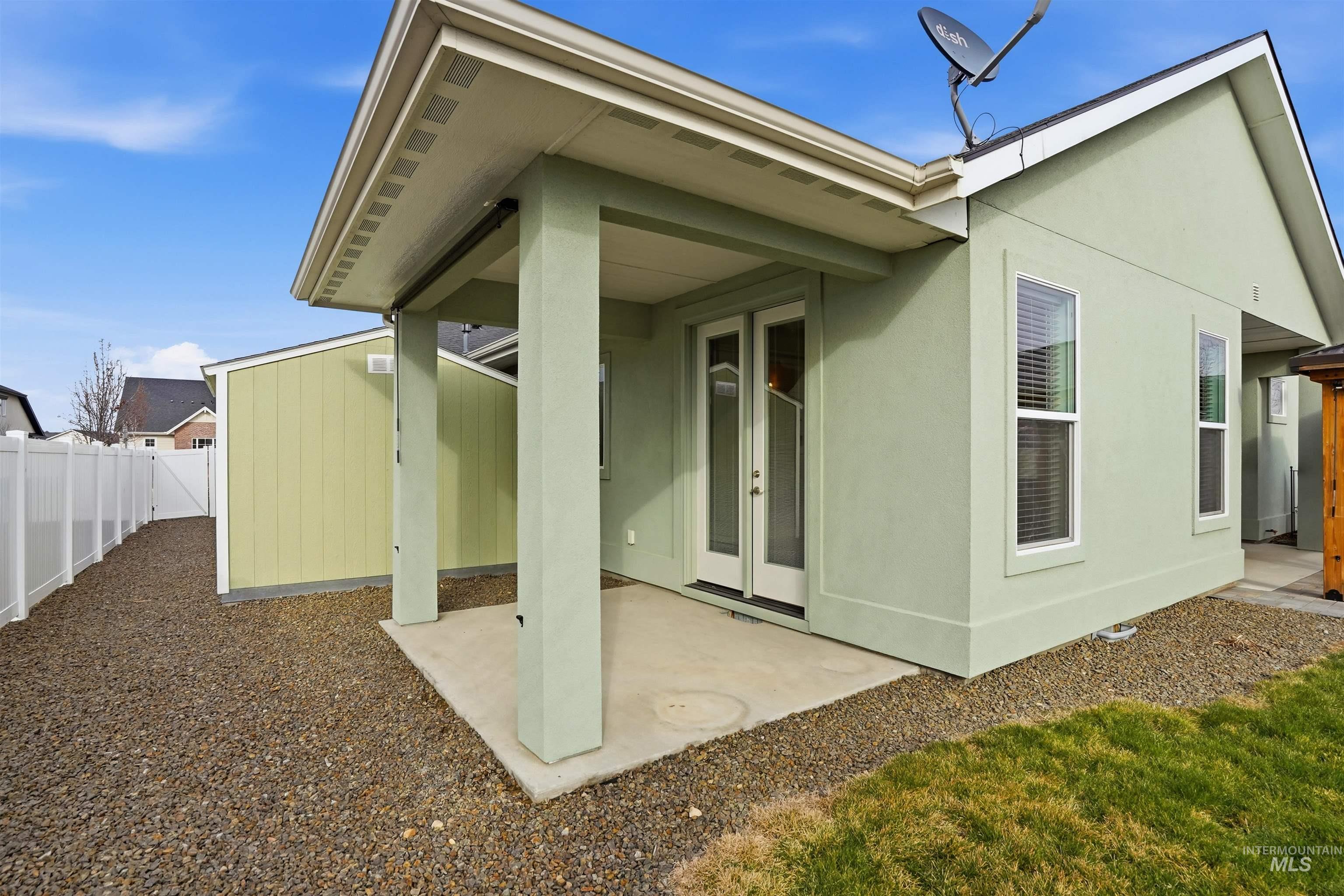 8087 Tandy Cove Street Middleton, ID 83644 - Photo 37 of 50 Back of property with a patio area, french doors, a fenced backyard, and stucco siding