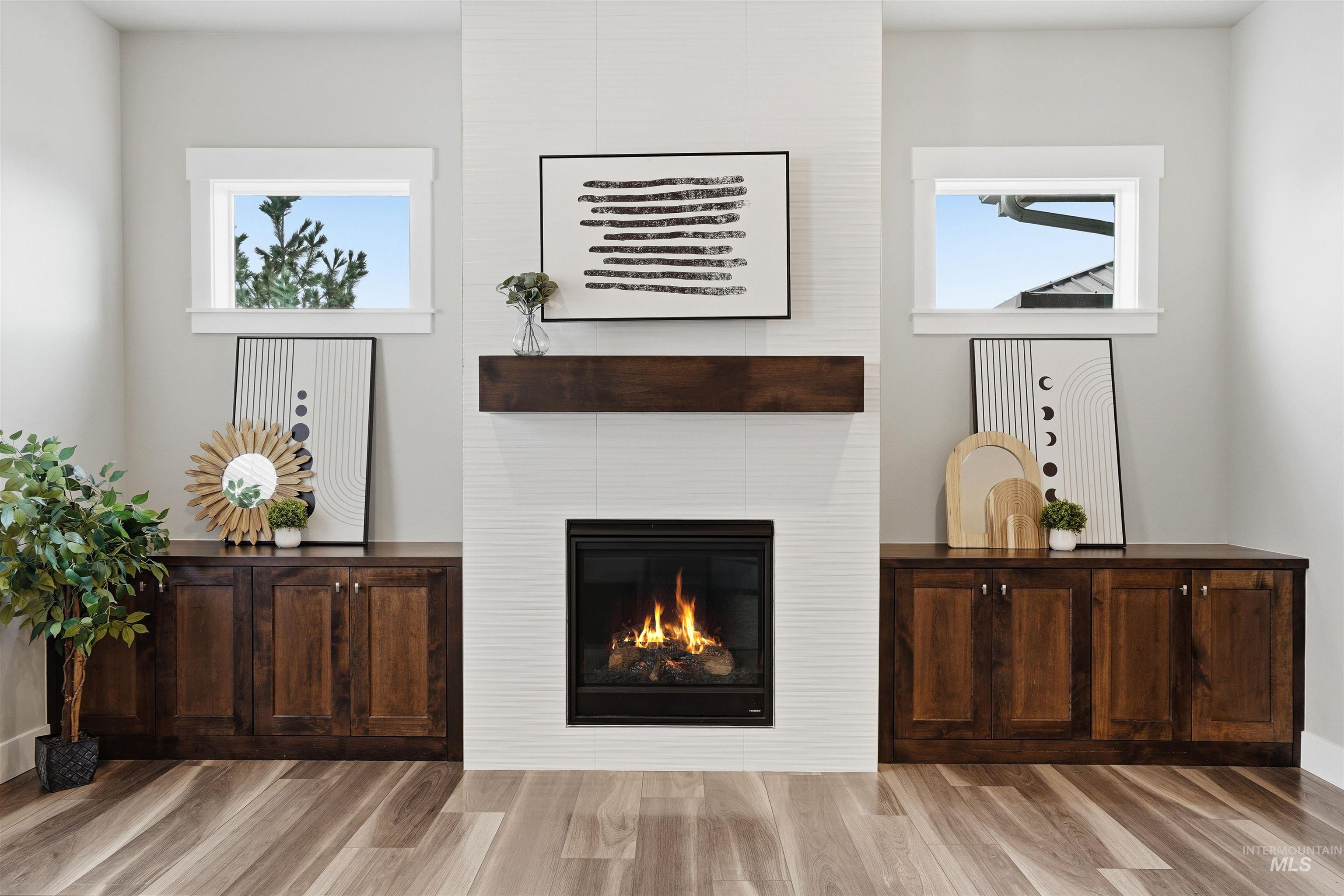 8087 Tandy Cove Street Middleton, ID 83644 - Photo 9 of 50 Living room with a large fireplace and light wood-style floors