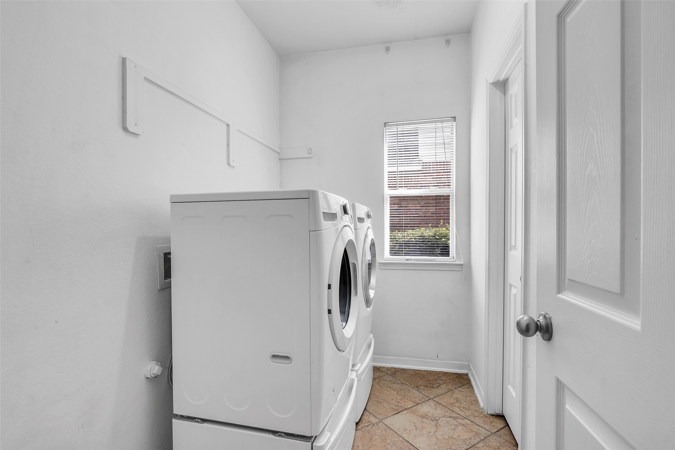 611 River Delta Lane Rosenberg, TX 77469 - Photo 13 of 39 a view of bathroom with washer and dryer