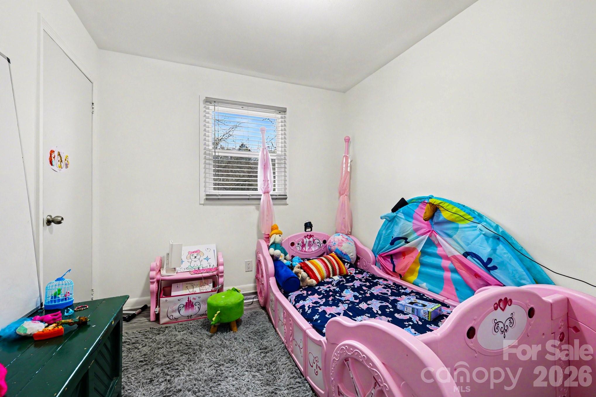 128 Paul Snipes Road Lancaster, SC 29720 - Photo 13 of 29 a bedroom with bed and ceiling fan