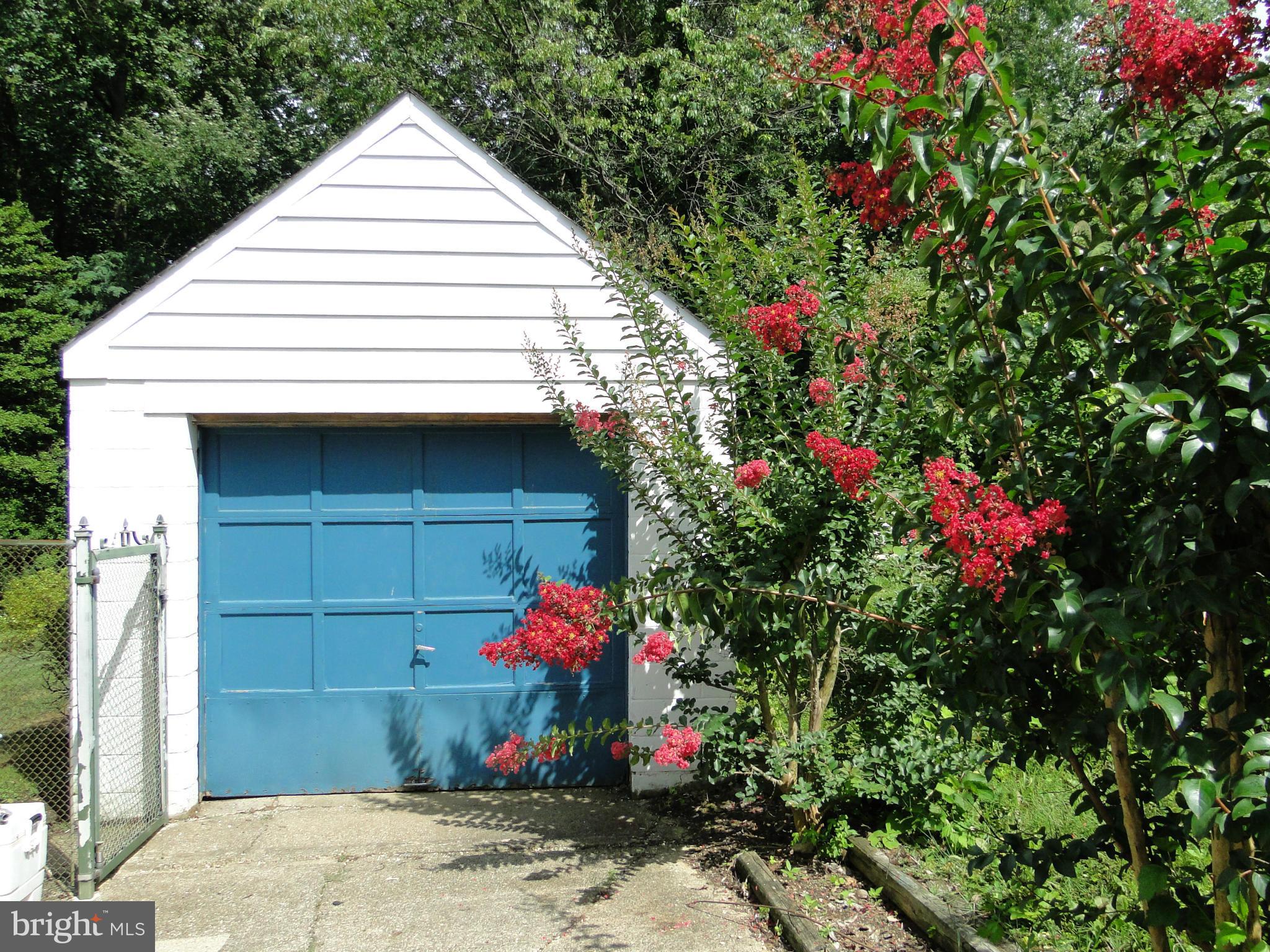 8419 Oakleigh Road Baltimore, MD 21234 - Photo 2 of 30 a front view of a house with a garage