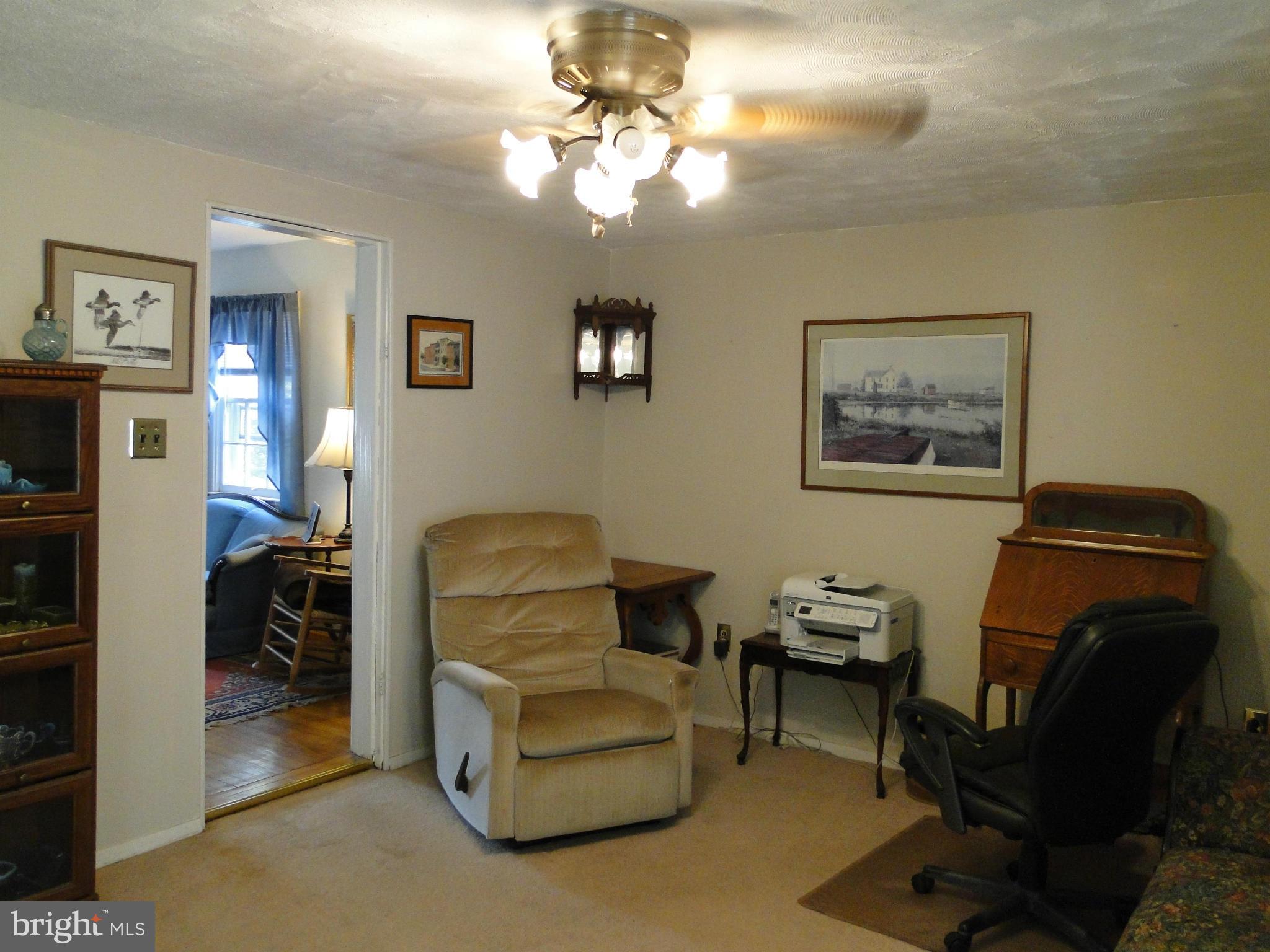 8419 Oakleigh Road Baltimore, MD 21234 - Photo 13 of 30 a living room with furniture and a chandelier