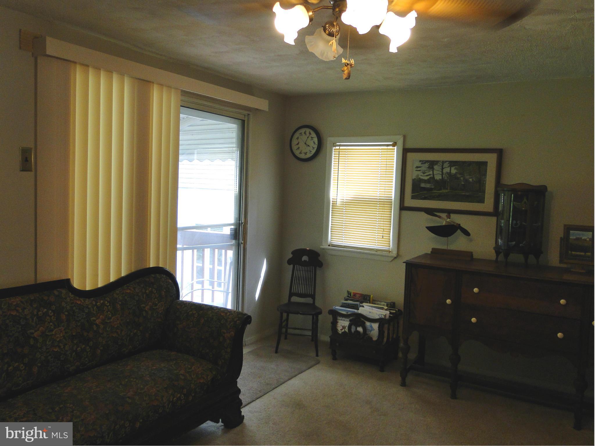 8419 Oakleigh Road Baltimore, MD 21234 - Photo 15 of 30 a living room with furniture and a window