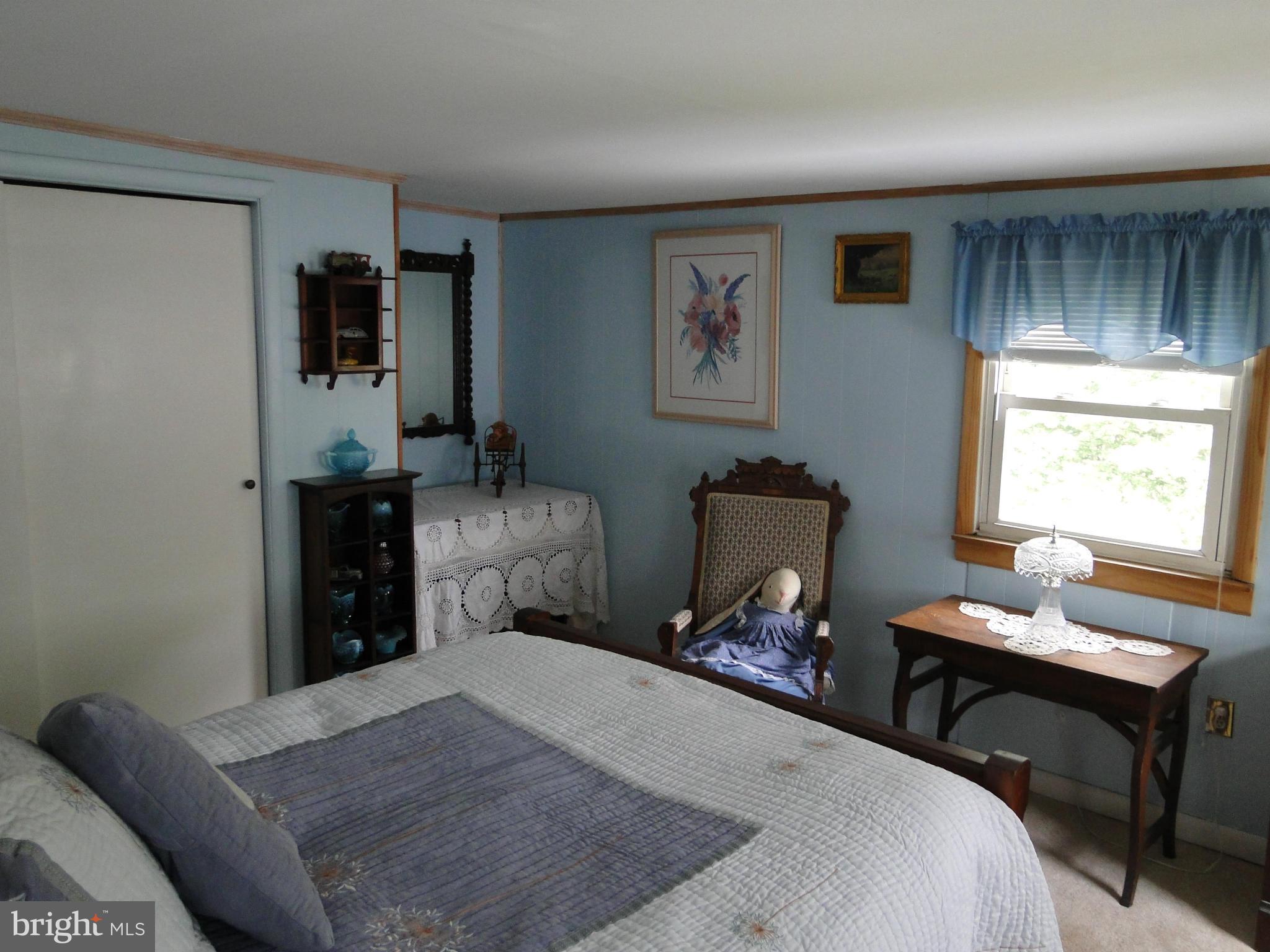 8419 Oakleigh Road Baltimore, MD 21234 - Photo 23 of 30 a bedroom with bed and a window