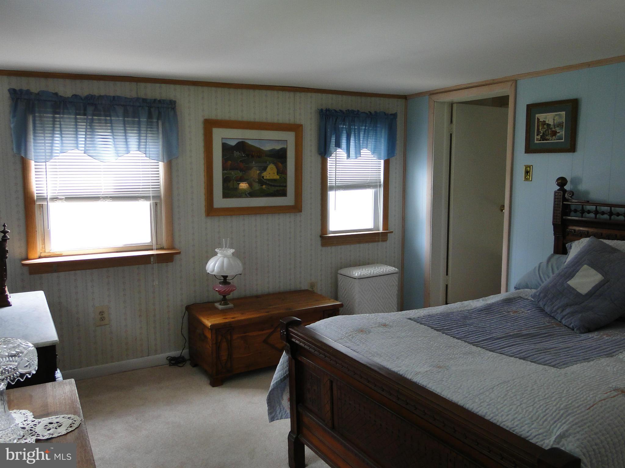 8419 Oakleigh Road Baltimore, MD 21234 - Photo 25 of 30 a bedroom with a bed and a window