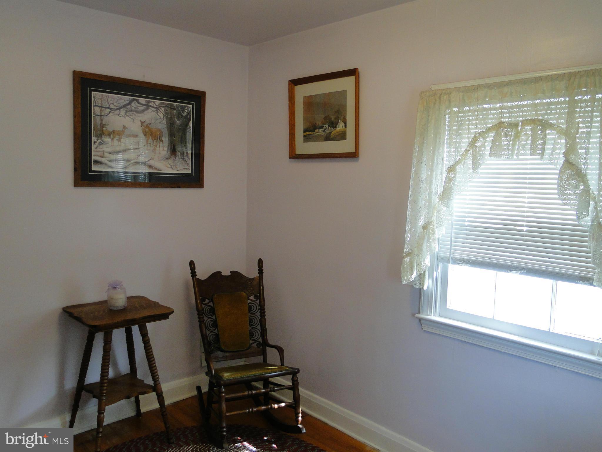 8419 Oakleigh Road Baltimore, MD 21234 - Photo 27 of 30 a view of a workspace with furniture and a window
