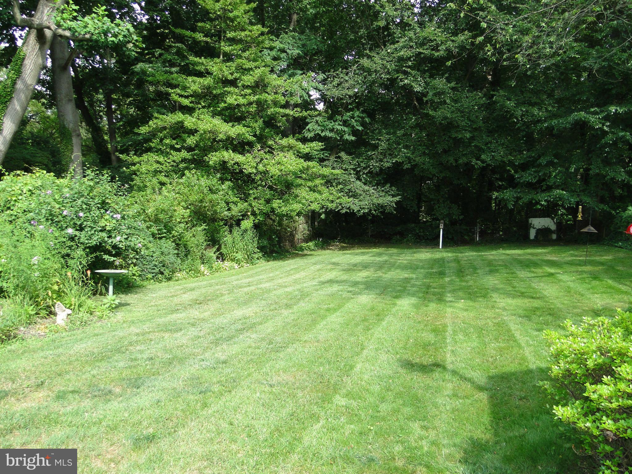 8419 Oakleigh Road Baltimore, MD 21234 - Photo 5 of 30 a view of green field with trees in the background