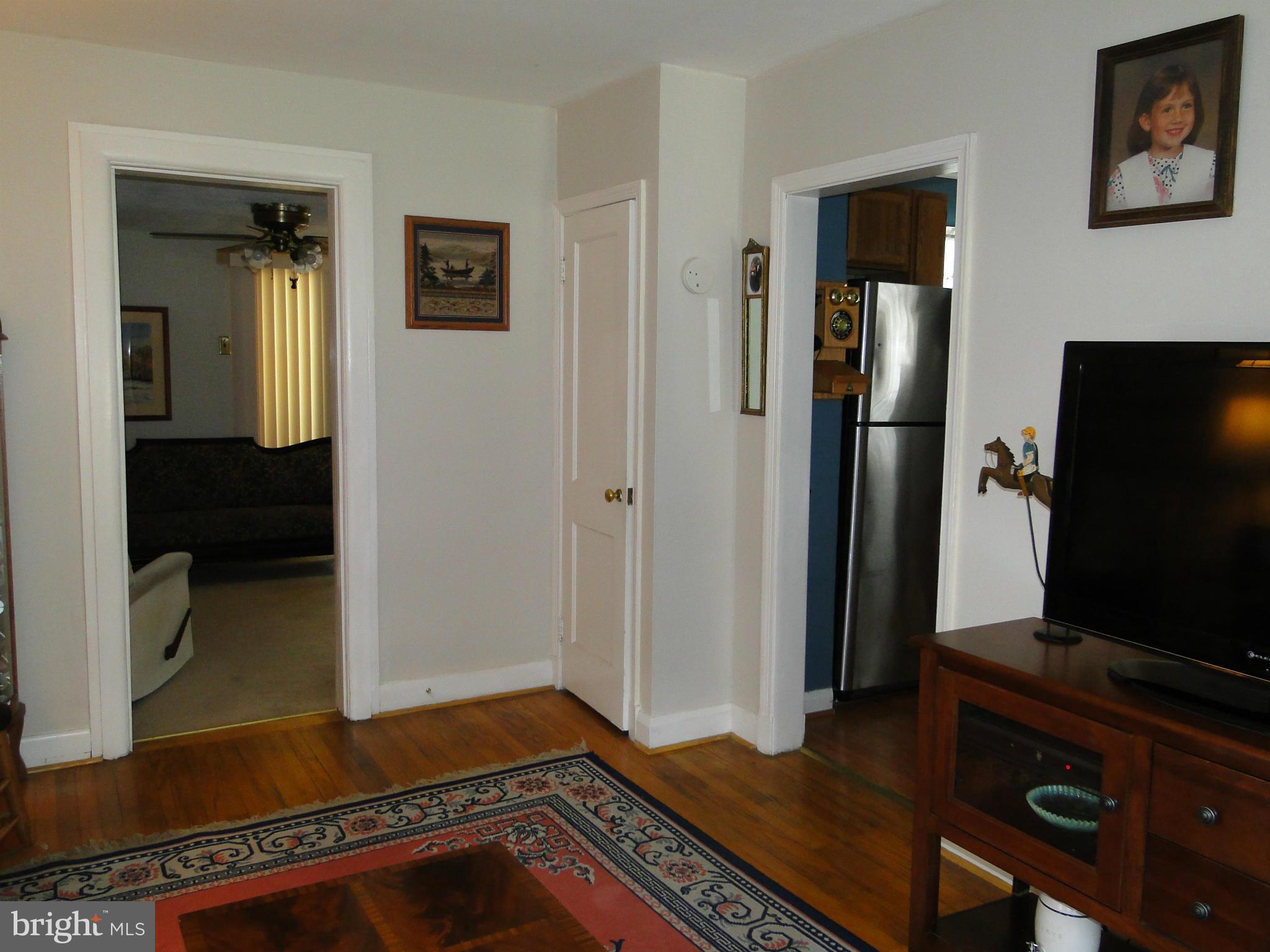 8419 Oakleigh Road Baltimore, MD 21234 - Photo 9 of 30 a view of a livingroom with furniture and a flat screen tv