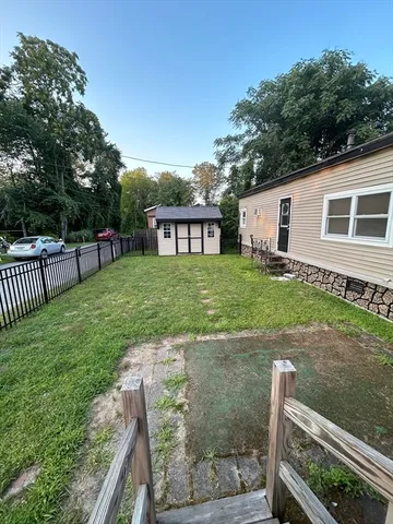 a view of a backyard with a garden