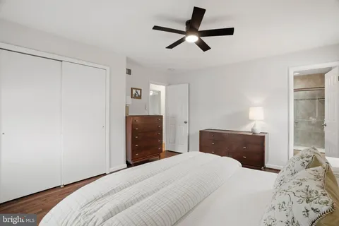 a bedroom with a bed and a dresser