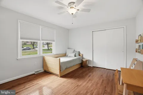 a room with a bed and a chandelier