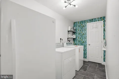 a bathroom with a sink mirror and vanity