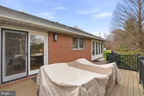 a view of a patio with a table and chairs