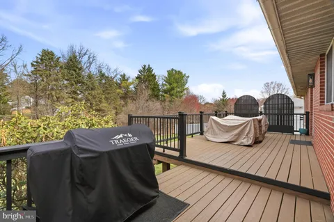 a terrace of a house with outdoor seating