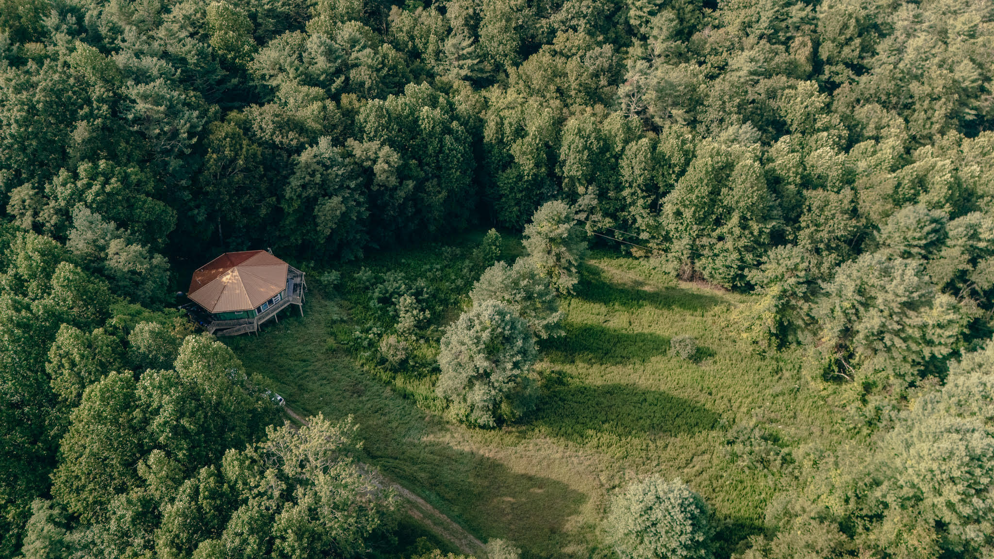 8780 Sugar Run Road Northeast Copper Hill, VA 24079 - Photo 3 of 25 an aerial view of a house with a yard