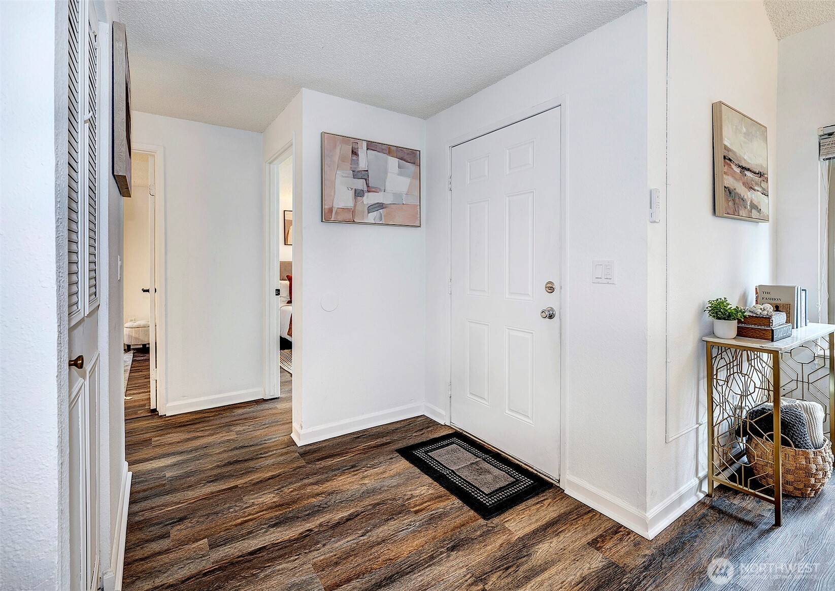 4308 Northeast Sunset Boulevard, Unit P1 Renton, WA 98059 - Photo 12 of 20 a view of a livingroom with wooden floor and a window