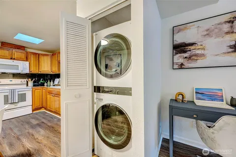 a view of a bedroom with washer and dryer