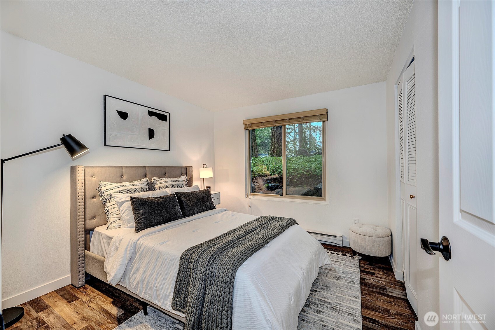 4308 Northeast Sunset Boulevard, Unit P1 Renton, WA 98059 - Photo 10 of 20 a bedroom with a bed and a window