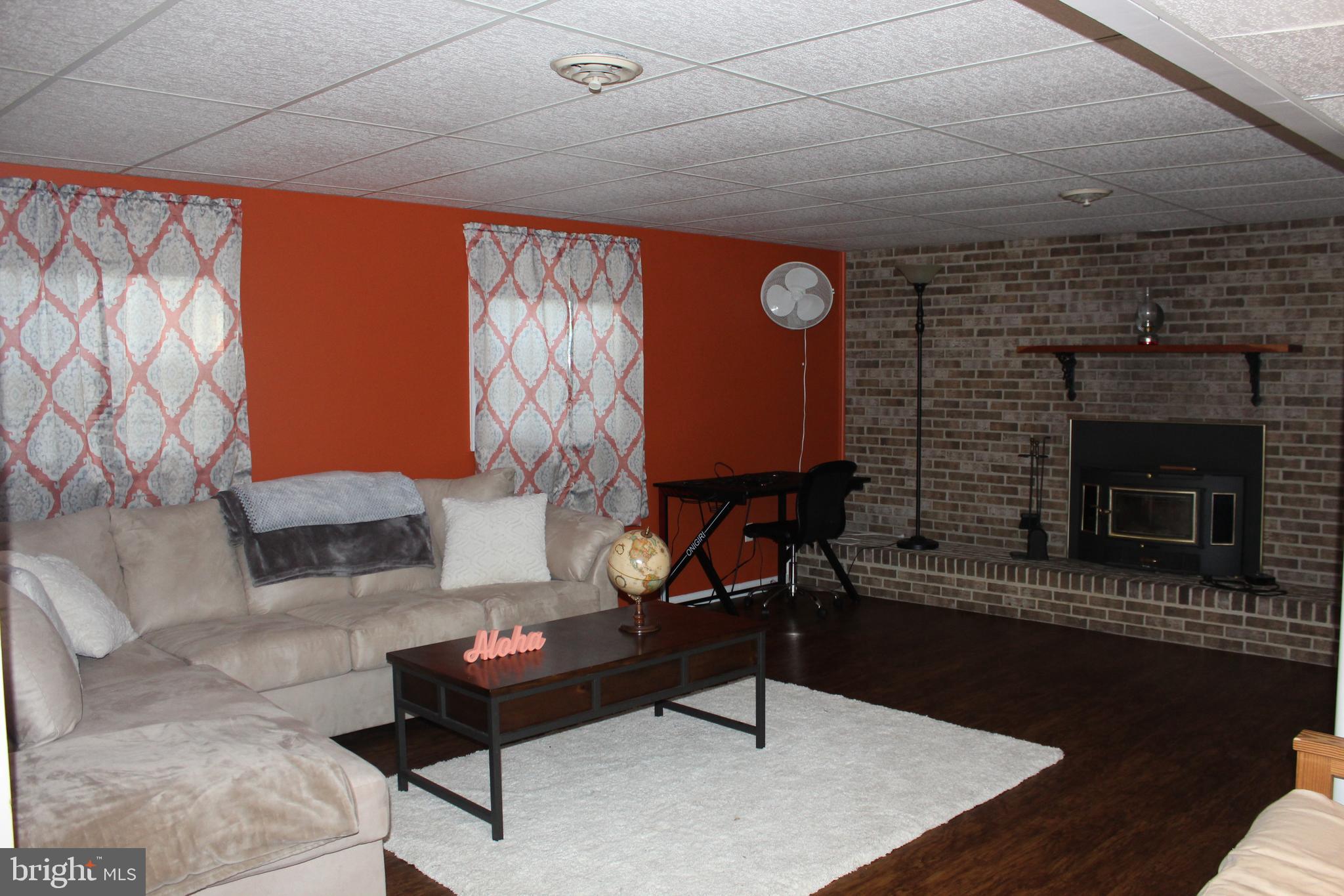 2032 Smoky Road Huntingtown, MD 20639 - Photo 28 of 42 Lower level family room, new vinyl floor 2020