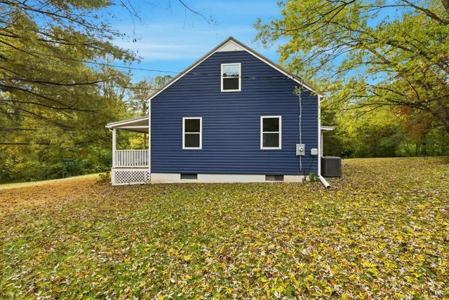 a brick house with a yard
