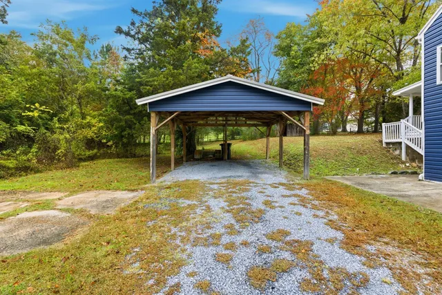 a view of backyard with a garden and entertaining space