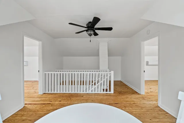 a view of a room with a wooden floor