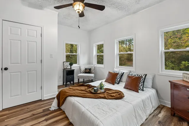 a bedroom with bed and window