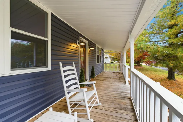 a view of a two chairs in the balcony