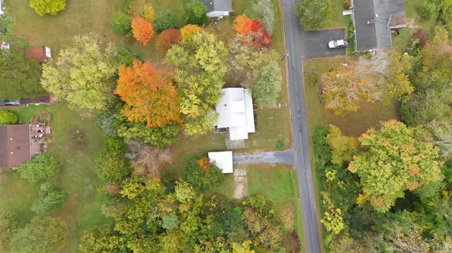 a bathroom with a small yard and green space