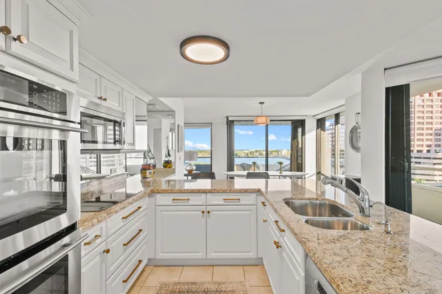 a living room with a large window and table