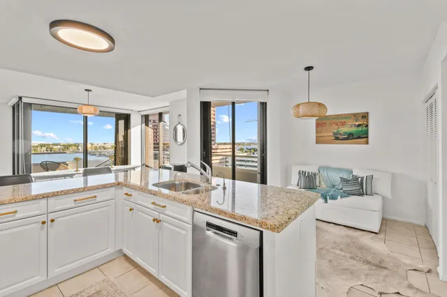 a view of a bedroom with furniture and wooden floor