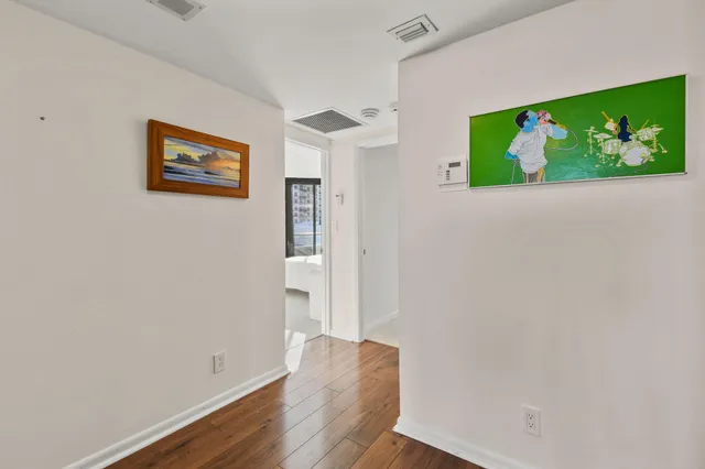 a bed room with a bed and a television