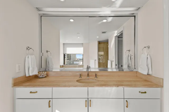 a spacious bedroom with a bed and a couch