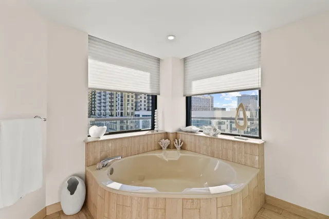 a bedroom with a bed and a lamp