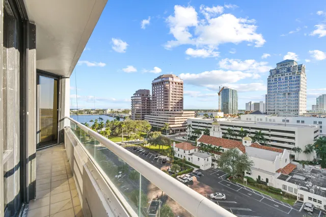 a dining hall with stainless steel appliances granite countertop a dining table and chairs