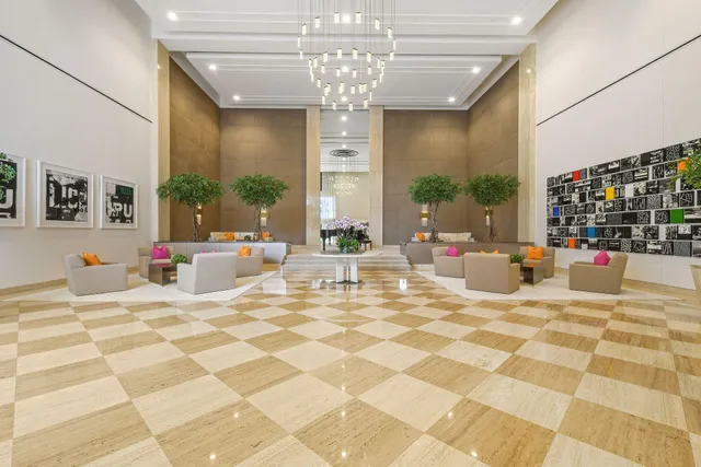 a view of a terrace with lawn chairs and potted plants