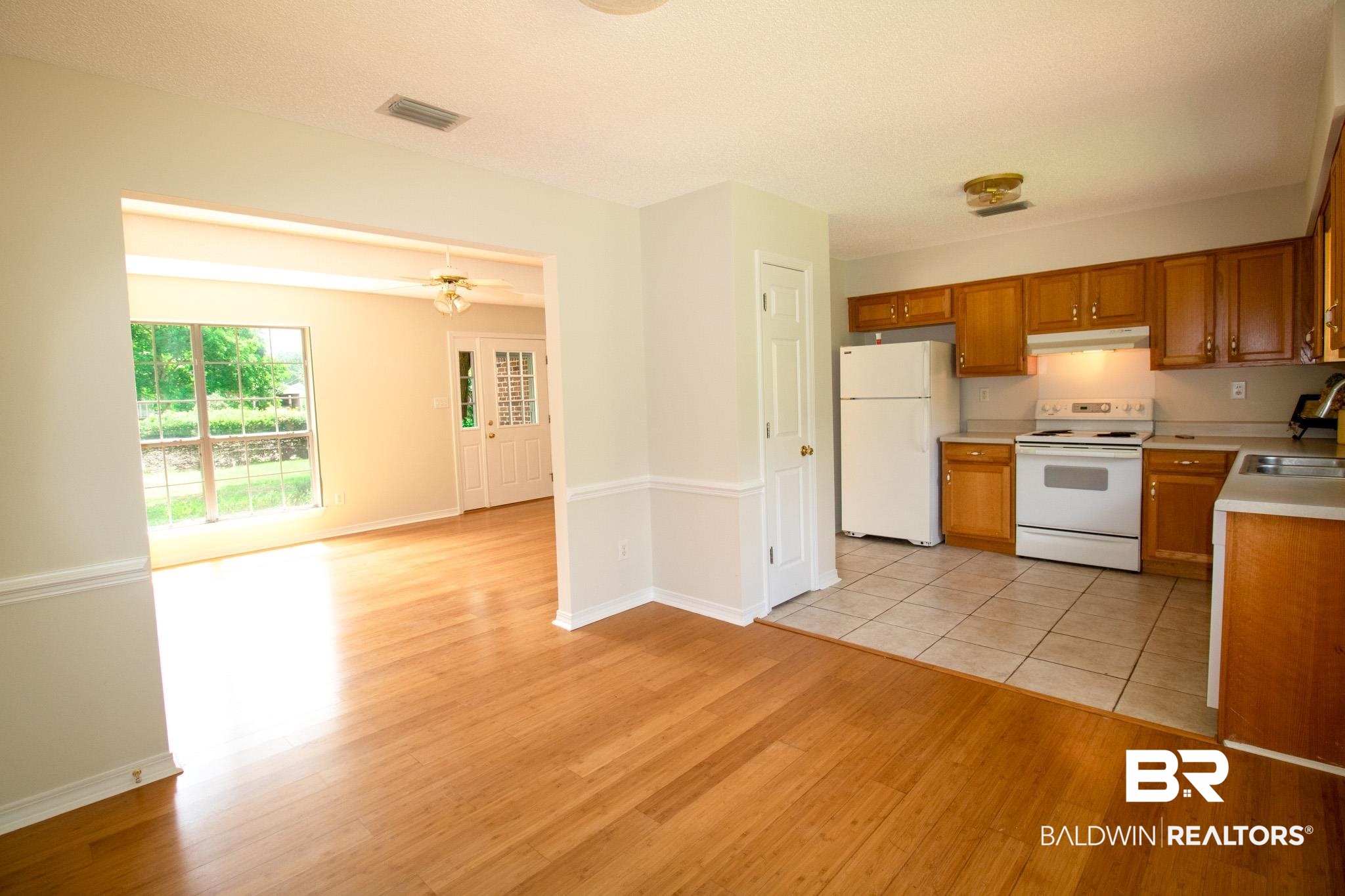 13255 Pointer Drive West Foley, AL 36535 - Photo 11 of 25 Kitchen featuring ceiling fan, sink, light hardwood / wood-style flooring, and white appliances