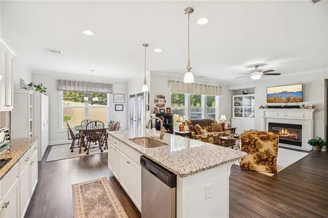 a large kitchen with a table and chairs