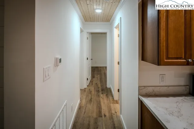 a view of a kitchen from the hallway