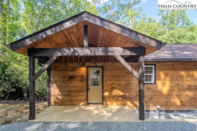 a view of a small house with a small yard