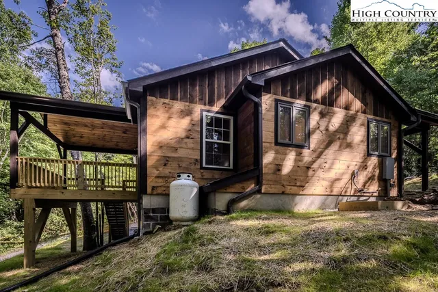 a view of house with a roof deck