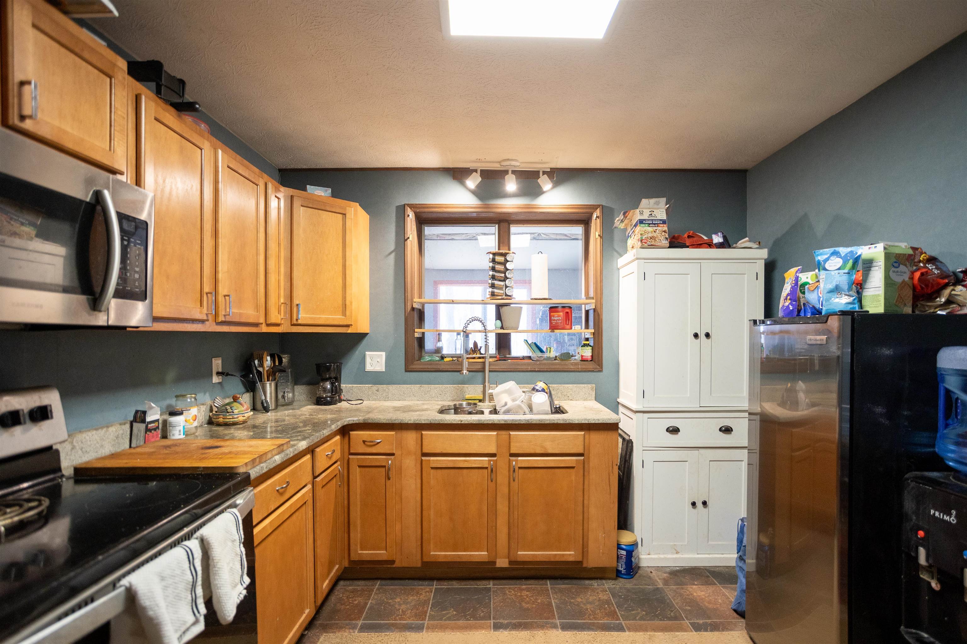 12619 Cardinal Forest Drive Fulks Run, VA 22830 - Photo 8 of 23 a kitchen with a sink stove and cabinets