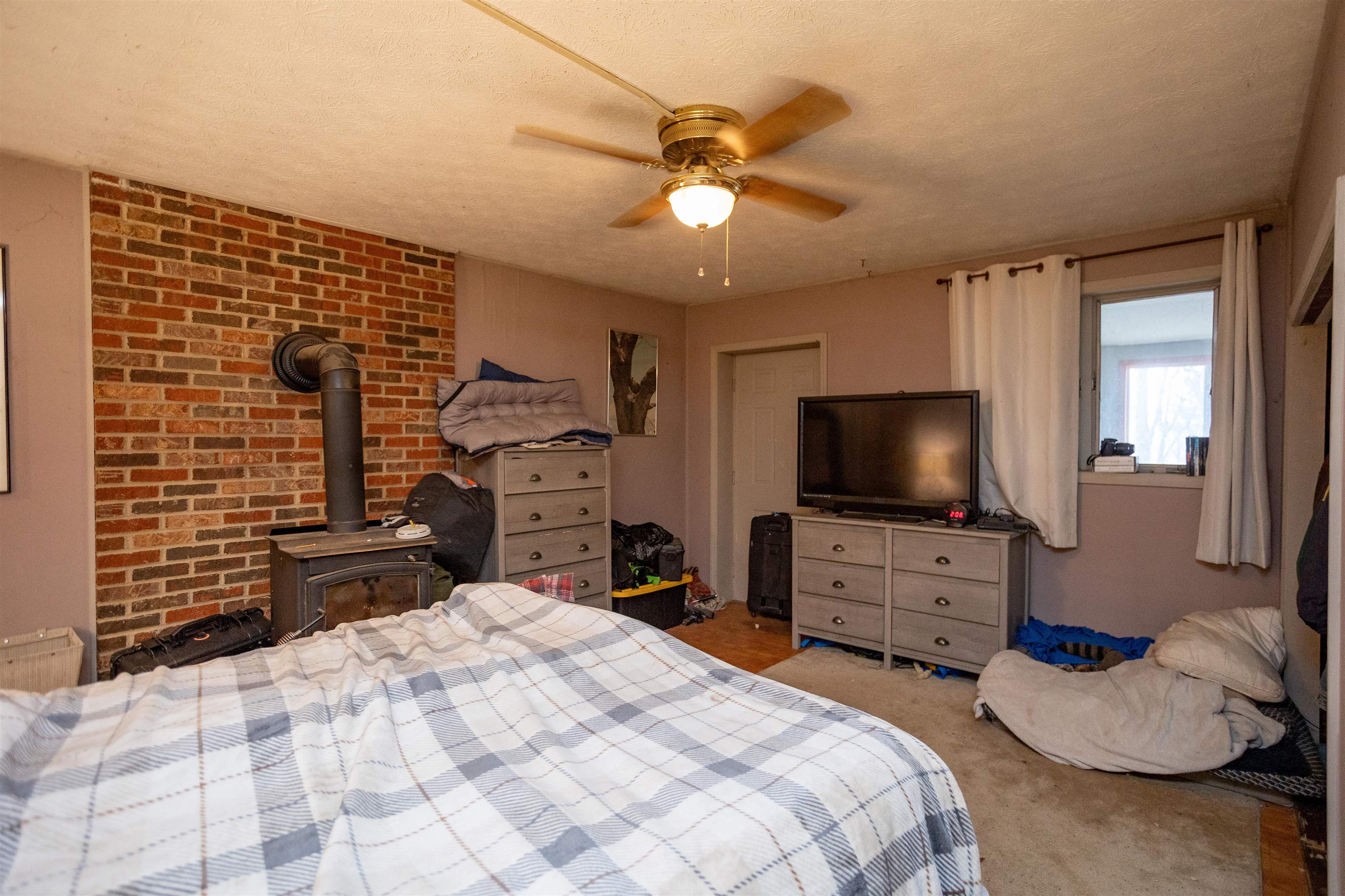 12619 Cardinal Forest Drive Fulks Run, VA 22830 - Photo 10 of 23 a bedroom with a bed and a flat tv screen on dresser