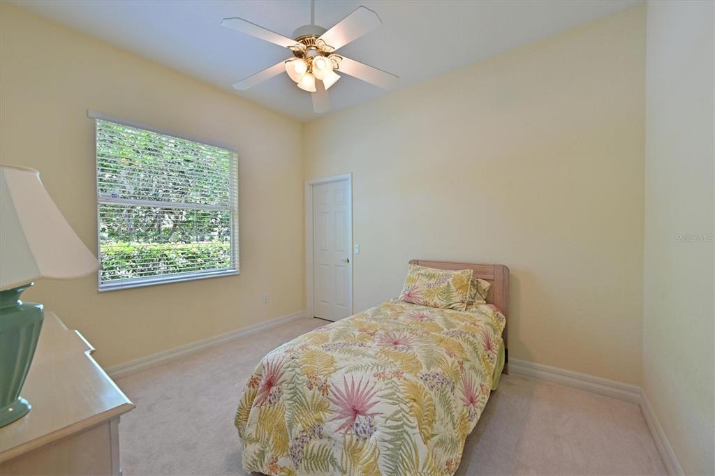10622 Conch Shell Terrace Bradenton, FL 34212 - Photo 38 of 69 a bedroom with a bed and a window