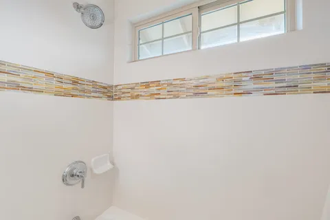 a view of an empty room with empty shelves